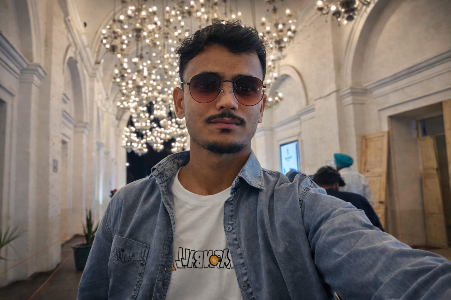 Saini Harish selfie in an indoor lit hall